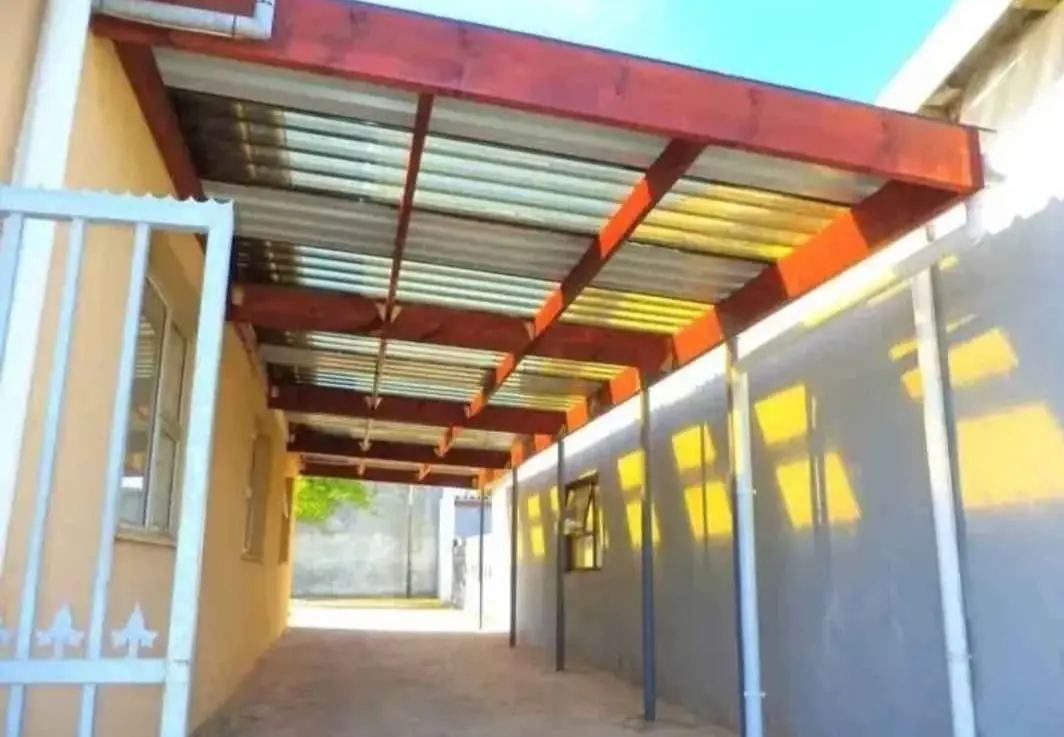 Red steel and corrugated roof carport